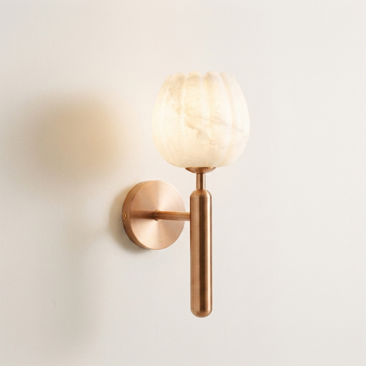 Maren marble and copper wall light on warm white wall